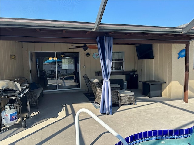 back of house featuring a patio area and a ceiling fan