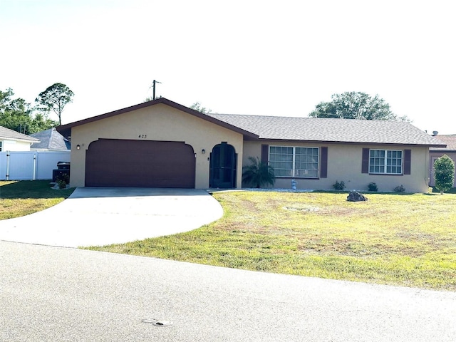 single story home with a front lawn, stucco siding, driveway, and a garage