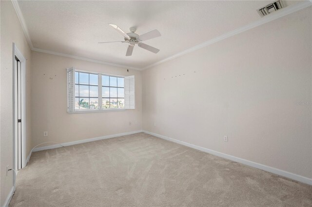 3800 Bal Harbor Blvd Unit 415, Punta Gorda, FL 33950 - empty room featuring ornamental molding, carpet, ceiling fan, and baseboards