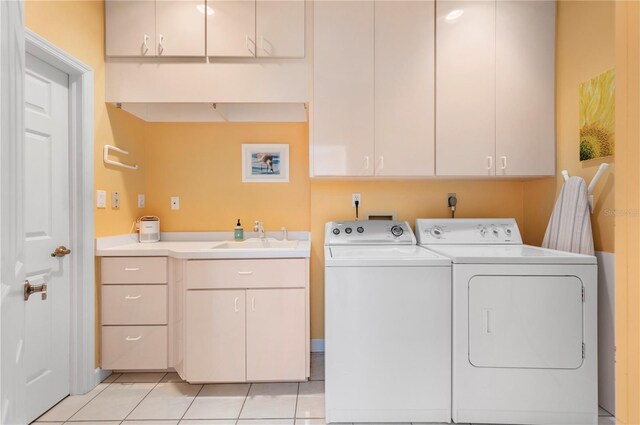 3800 Bal Harbor Blvd Unit 415, Punta Gorda, FL 33950 - laundry area featuring cabinet space, washer and clothes dryer, and light tile patterned floors