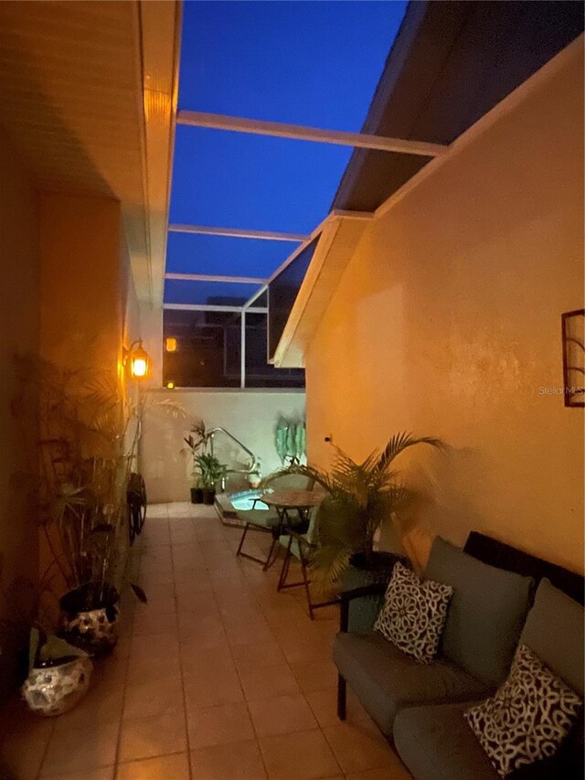 3800 Bal Harbor Blvd Unit 415, Punta Gorda, FL 33950 - patio at night with a patio and glass enclosure