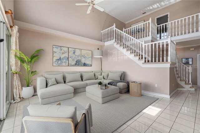 3800 Bal Harbor Blvd Unit 415, Punta Gorda, FL 33950 - living area with stairs, light tile patterned flooring, a high ceiling, ceiling fan, and baseboards