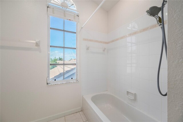 3800 Bal Harbor Blvd Unit 415, Punta Gorda, FL 33950 - bathroom featuring baseboards and shower / washtub combination