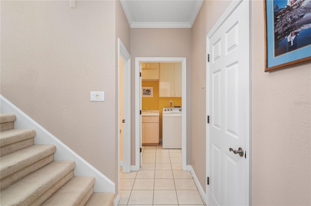 3800 Bal Harbor Blvd Unit 415, Punta Gorda, FL 33950 - hallway with washer / dryer, crown molding, light tile patterned flooring, a sink, and baseboards