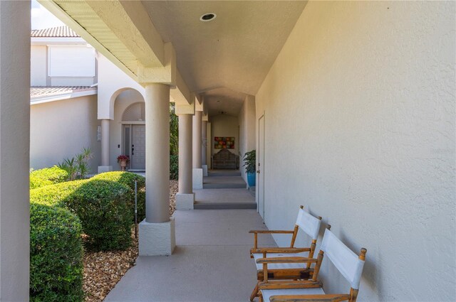 3800 Bal Harbor Blvd Unit 415, Punta Gorda, FL 33950 - property entrance with stucco siding and a porch