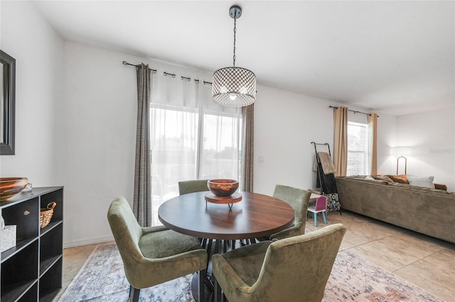 dining area featuring light tile patterned flooring