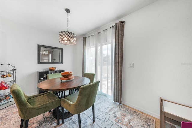 dining area featuring baseboards
