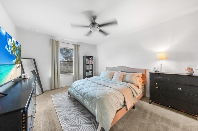 bedroom with light colored carpet and ceiling fan