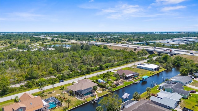 2911 Riverside Dr, Punta Gorda, FL 33950 - aerial perspective of suburban area with a nearby body of water, a notable bridge, and a tree filled landscape