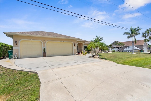 2911 Riverside Dr, Punta Gorda, FL 33950 - view of front facade with stucco siding, driveway, a garage, and a front lawn