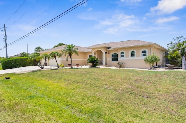 2911 Riverside Dr, Punta Gorda, FL 33950 - mediterranean / spanish-style house with stucco siding, concrete driveway, and a garage