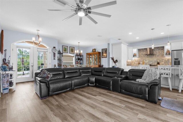2911 Riverside Dr, Punta Gorda, FL 33950 - living area featuring a chandelier, light wood-type flooring, recessed lighting, and a ceiling fan
