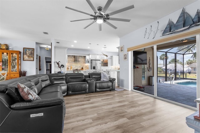 2911 Riverside Dr, Punta Gorda, FL 33950 - living room featuring a ceiling fan, light wood finished floors, and recessed lighting