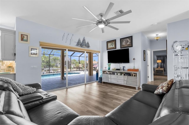 2911 Riverside Dr, Punta Gorda, FL 33950 - living room with ceiling fan and wood finished floors
