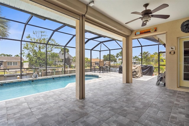 2911 Riverside Dr, Punta Gorda, FL 33950 - swimming pool with ceiling fan, a patio area, a lanai, and outdoor dining space