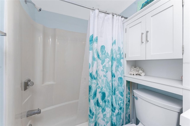 bathroom with toilet and shower / tub combo