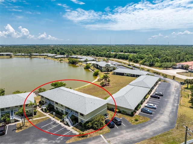 birds eye view of property featuring a water view