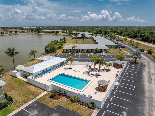 birds eye view of property with a water view