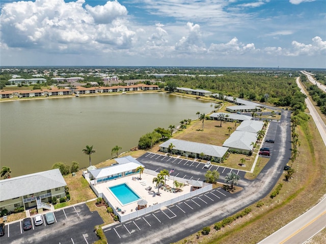birds eye view of property with a water view