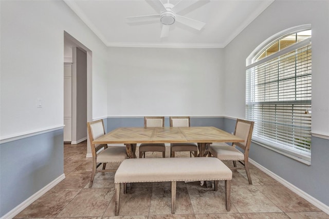 12951 SW Kingsway Cir, Lake Suzy, FL 34269 - dining space with crown molding, ceiling fan, and baseboards