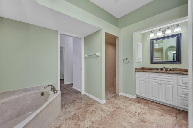 12951 SW Kingsway Cir, Lake Suzy, FL 34269 - bathroom with vanity, a bath, a walk in shower, and baseboards