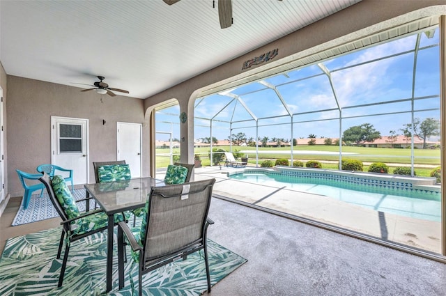 12951 SW Kingsway Cir, Lake Suzy, FL 34269 - view of patio featuring ceiling fan, an outdoor pool, outdoor dining area, and a lanai