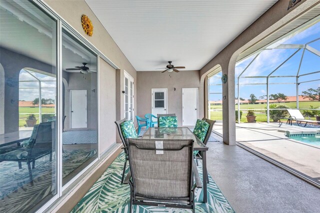 12951 SW Kingsway Cir, Lake Suzy, FL 34269 - sunroom featuring a ceiling fan and healthy amount of natural light