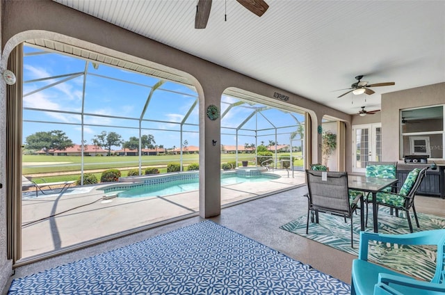 12951 SW Kingsway Cir, Lake Suzy, FL 34269 - view of patio featuring ceiling fan, a pool with connected hot tub, glass enclosure, and outdoor dining area