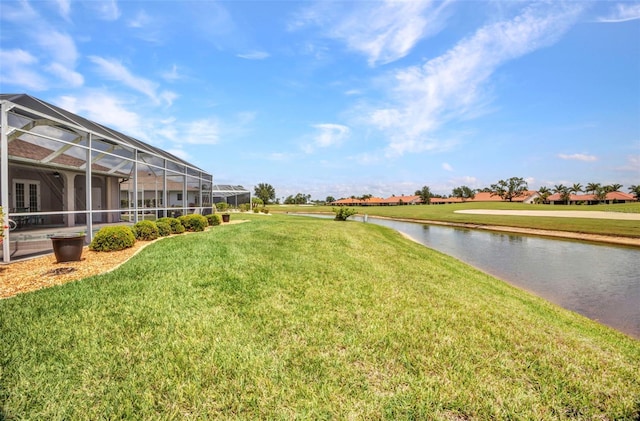 12951 SW Kingsway Cir, Lake Suzy, FL 34269 - view of grassy yard with a water view and a lanai