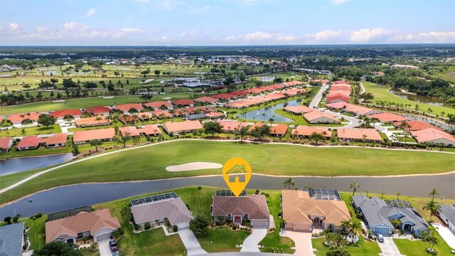 12951 SW Kingsway Cir, Lake Suzy, FL 34269 - aerial view of property and surrounding area featuring a golf course, a large body of water, and nearby suburban area