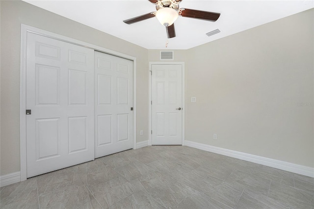 unfurnished bedroom featuring a ceiling fan, baseboards, a closet, and visible vents