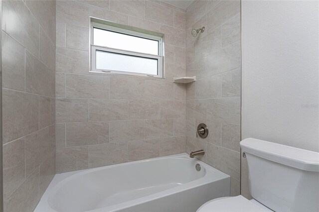 bathroom featuring toilet and shower / bath combination