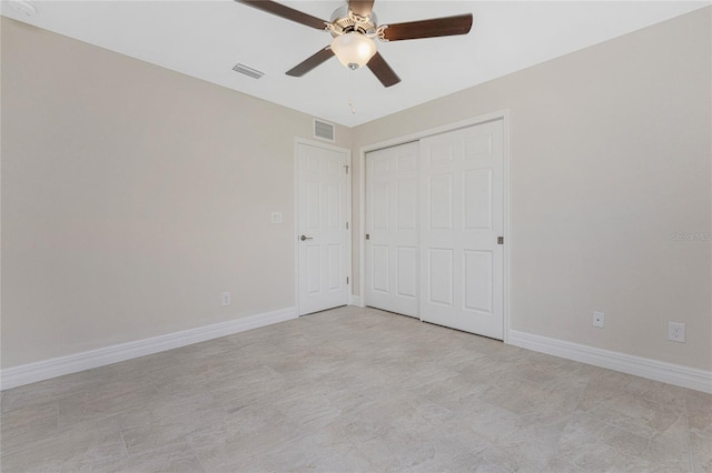 unfurnished bedroom featuring ceiling fan, a closet, baseboards, and visible vents