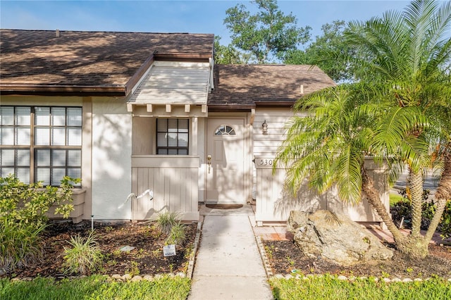 5301 Linksman Pl, North Port, FL 34287 - property entrance with a shingled roof