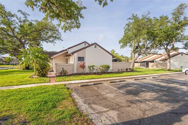 5301 Linksman Pl, North Port, FL 34287 - view of front of house featuring uncovered parking and stucco siding