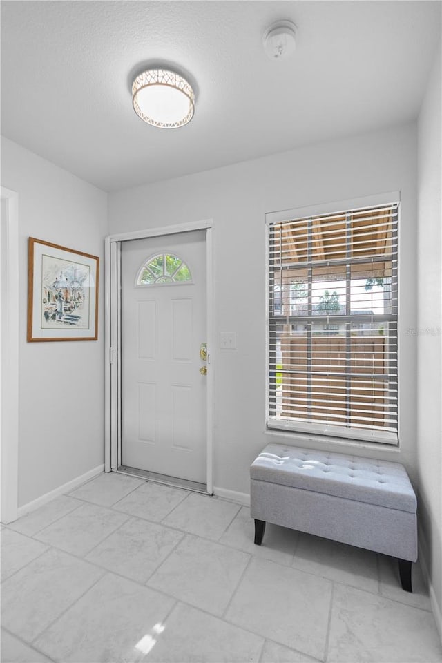 5301 Linksman Pl, North Port, FL 34287 - foyer entrance with baseboards and marble look tiles