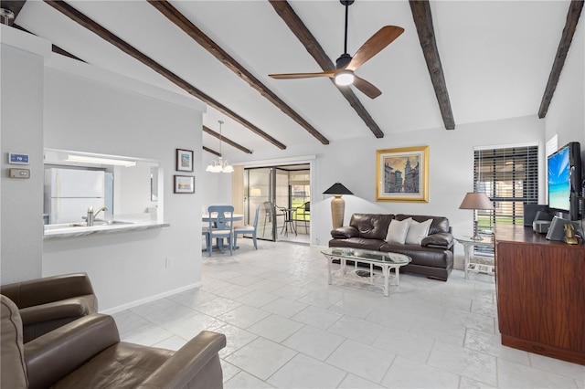 5301 Linksman Pl, North Port, FL 34287 - living room with a ceiling fan, a chandelier, and baseboards