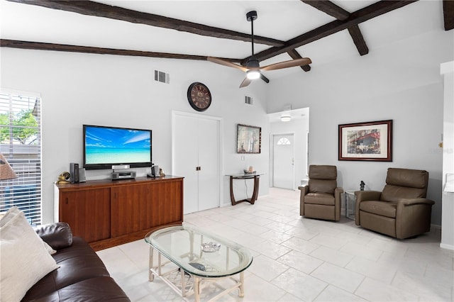 5301 Linksman Pl, North Port, FL 34287 - living room with beam ceiling, a ceiling fan, and high vaulted ceiling