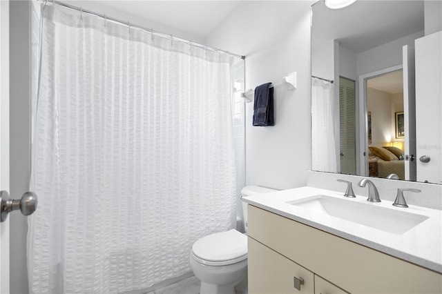 5301 Linksman Pl, North Port, FL 34287 - ensuite bathroom with toilet, vanity, and a shower with shower curtain