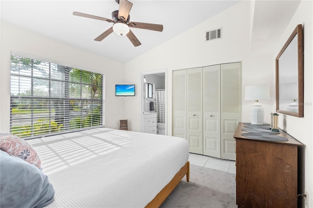 5301 Linksman Pl, North Port, FL 34287 - bedroom featuring lofted ceiling, light tile patterned floors, a closet, ceiling fan, and ensuite bathroom