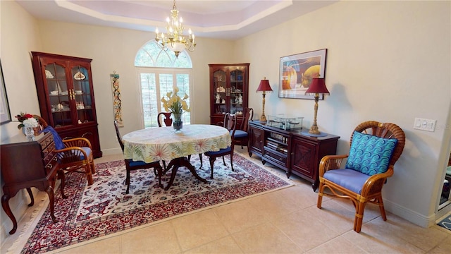 8596 SW Riverside Dr, Arcadia, FL 34269 - dining area with a chandelier, a raised ceiling, and baseboards