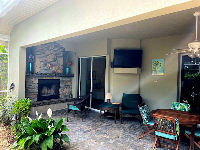 8596 SW Riverside Dr, Arcadia, FL 34269 - view of patio / terrace featuring a stone fireplace