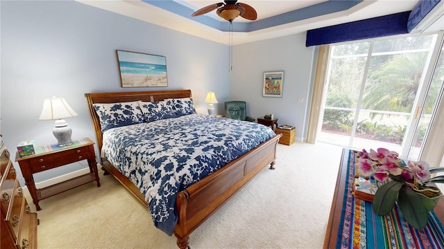 8596 SW Riverside Dr, Arcadia, FL 34269 - bedroom featuring carpet floors, a raised ceiling, and ceiling fan