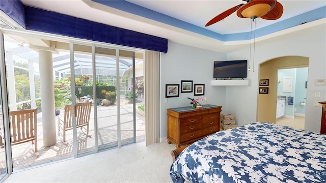 8596 SW Riverside Dr, Arcadia, FL 34269 - bedroom featuring access to outside, multiple windows, light colored carpet, and arched walkways