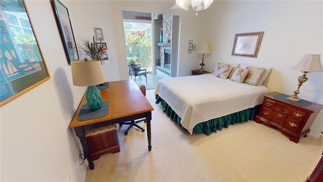 8596 SW Riverside Dr, Arcadia, FL 34269 - carpeted bedroom featuring access to exterior and a fireplace