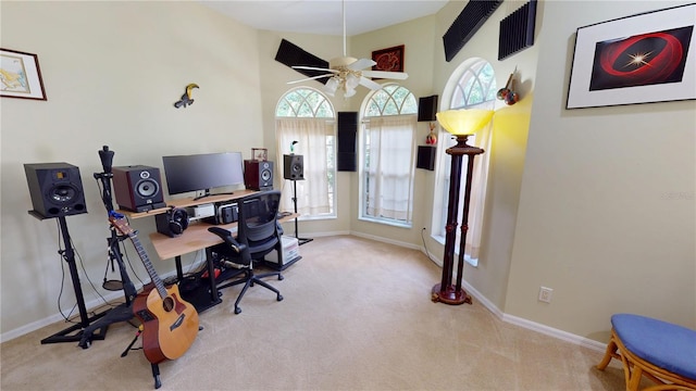 8596 SW Riverside Dr, Arcadia, FL 34269 - carpeted home office with a ceiling fan, baseboards, and a high ceiling