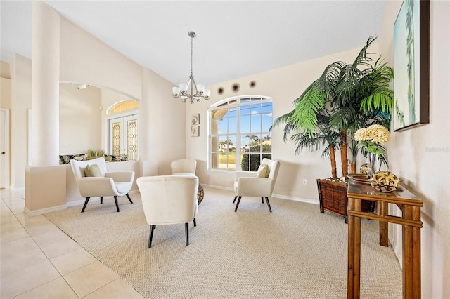 living area with a chandelier, vaulted ceiling, carpet flooring, tile patterned flooring, and baseboards