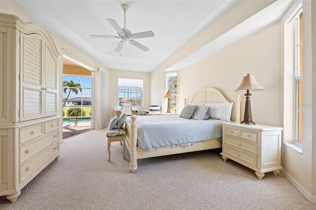 bedroom with light colored carpet, access to exterior, ceiling fan, and baseboards