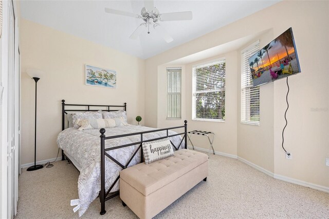 bedroom featuring carpet flooring, baseboards, and ceiling fan