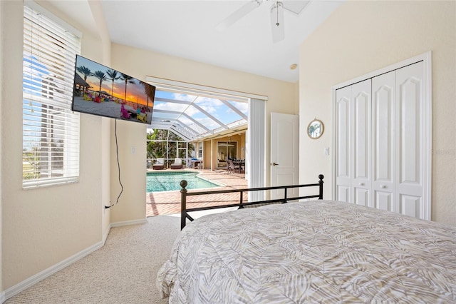 carpeted bedroom with vaulted ceiling, access to outside, baseboards, a closet, and ceiling fan